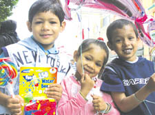 Kadir and Khaled Ali and Aishah Khatun show off their festival toys 