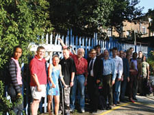 Neighbours protesting at plans for a block of flats they say wil block sunlightin their homes   