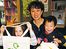 Song Jing Lin with Ella Carroll, 8, and Yoyo Lin, 3