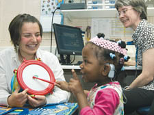 Angela and Noli Tebe with Royal Free audiology department clinical scientist Jane Bradley, right