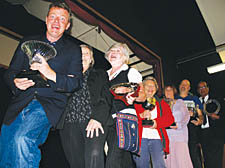 Suggs with the first prize-winners, from front, Margaret Johnson, Celia Aherne, Eileen Yates, Kate Spencer, Mike Cookson-Taylor and Mr W Osmany