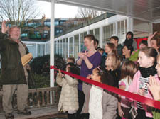 Pictured, left, Bill Oddie prepares to open the market and, above, Sam Crow is pictured with Hazel Dewar, 8, and Eve Bunting, 8, enjoying the fun. 