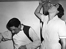 Eleanor and husband John Barbirolli at work in the kitchen