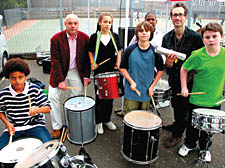 Year 8 boys, new headmaster Robbie Cathcart and music teacher Daniel Barrow playing the drums