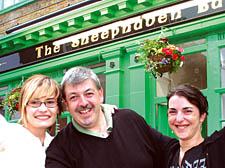 Landlord Pat Logue with his bar staff Mariola Majda and Belei Reyes