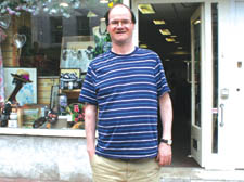 Colin Findlay outside the Highgate Oxfam shop where he works