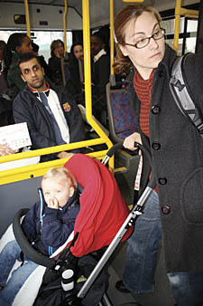 Posy Parsons with daughter Eliza and buggie on a rush hour bus