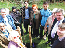 Age Concern staff and members with councillors James King and Abdul Hai at the new orchard