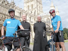 Fr Philip North and Peter Garvie with Canon Neil Heavisides and The Very Reverend Nick Bury at Gloucester Cathedral, one of the many visits they made across the country during their marathon cycle ride