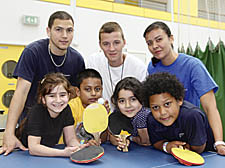 NVQ students (back, from left) Samuel Molina, Jon Powley and Kerry Hunte with Rhyl Primary School hot-shots Yashir, Alaa, Sarah and Zekiel