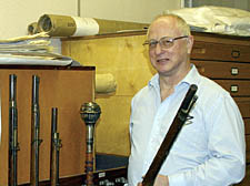 Malcolm Holmes with an exhibit from the history archive  