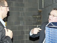 Town Hall director of sport Nigel Robinson, left, and a Euro Pools representative attempt to resolve the mechanical problems at Swiss Cottage Leisure Centre