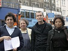 Fortess Road traders Sally Celik, Aysec Celik, Stephen Fisher, Messelu Worku, with the petition