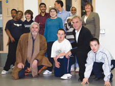 John Alderton (bottom left) with pupils and staff 