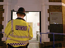 A police officer outside City University