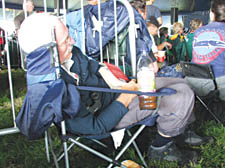 A Glastonbury reveller doesn’t let the music get in the way of his afternoon nap