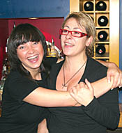 Waitresses Ewelina Wasiewicz, from Poland and Greek Vassiliki Vrioni, at Café Corfu