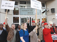 Protest: Lady Sainsbury with the megaphone rallies campaigners outside the diocese HQ