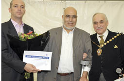 Mohamed Taleouine receives his award from Deputy Lord Mayor Dr Cyril Nemeth